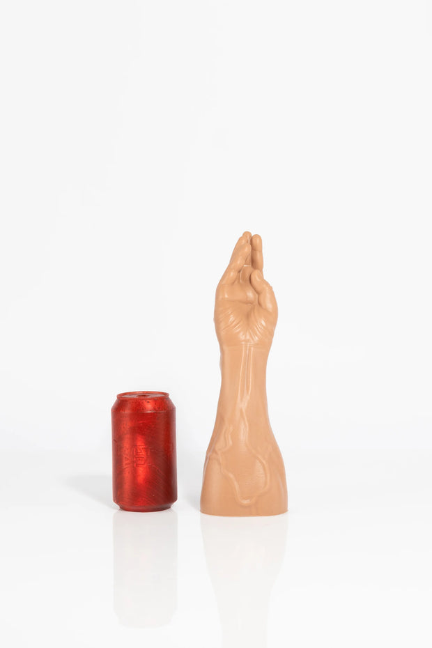 A size comparison photo of a medium fist dildo.