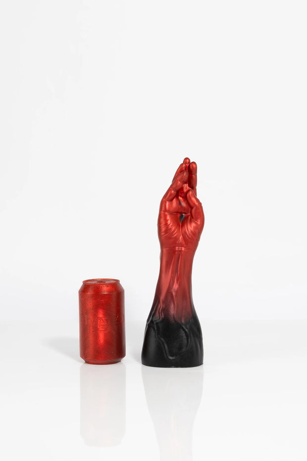 A photo of a medium sized ombre coloured fist dildo.