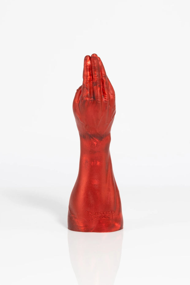 A product photo of a red fist dildo taken from behind.