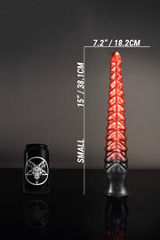 A size comparison of a small tentacle dildo by a tin can.
