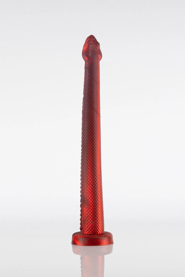 A red, textured snake dildo with a narrow body and a pointed head, displayed against a white background.